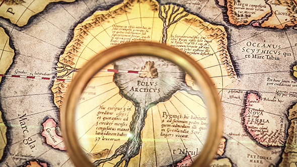 Vintage Magnifying Glass Lies On The Ancient Map