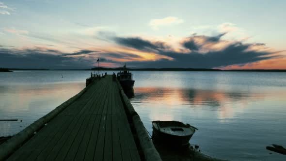 Tranquil Sunrise on Lake with Wooden Pier