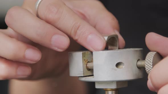 Hands of Jeweler Working on Metal Ring