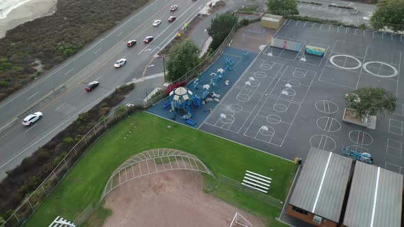 A drone circles an empty school playground from above which is closed due to the Corona Virus Covid-