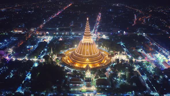 Aerial top view of Phra Pathommachedi temple at night in Nakorn Pathom district, Thailand.