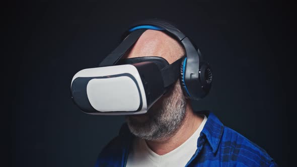 Close Up of a Bearded Man Wearing Virtual Reality Glasses No Black Background