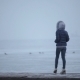 Lone Girl Walking On a Pier In The Frozen Sea - VideoHive Item for Sale