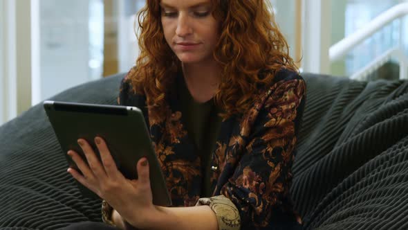 Businesswoman using digital tablet in office 4k