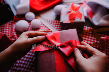 x with gifts. Wrapping christmas gift.