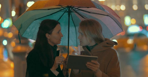 Women Using Pad To Find Way In The City alt