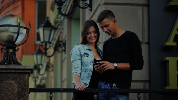Man And Woman On The Phone Leaf Photo