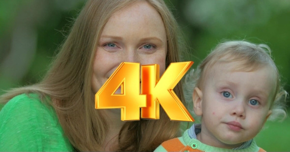 Young Mother With Cute Little Child Outdoor alt