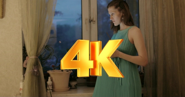 Pregnant Woman Using Pad And Embracing Belly alt