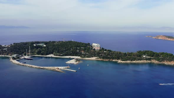 Greece, Athens riviera coast, Vouliagmeni bay, calm sea and blue sky background