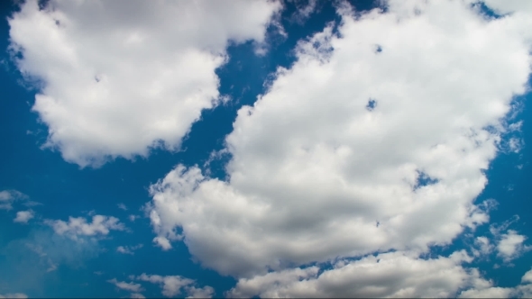 Clouds Moving In The Blue Sky.