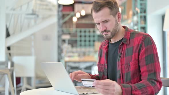 Unsuccessful Online Payment on Laptop By Young Man