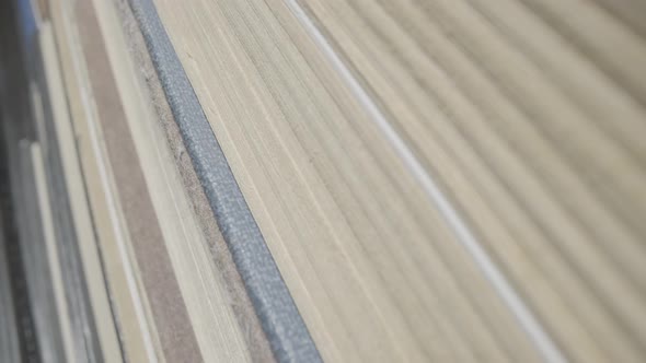 Macro of a Stack of Old Books with Gray Shabby Covers and Yellowed Pages