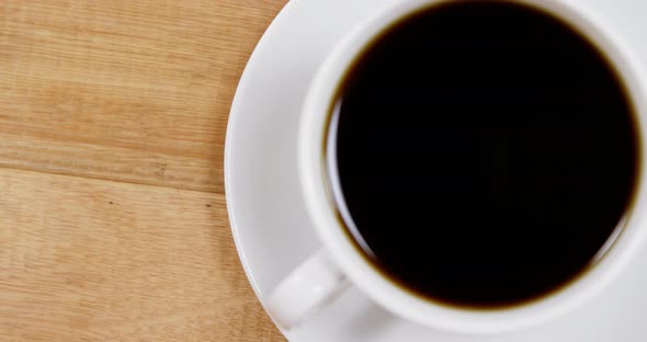 Close-up of coffee cup with saucer