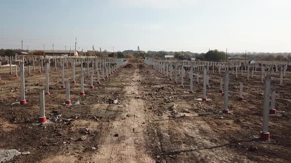 Steel Poles in the Field for Mounting Racks for Solar Panels Construction Site
