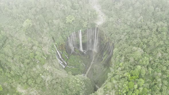 Drone Through Mist Over Tumpak Sewu Waterfalls