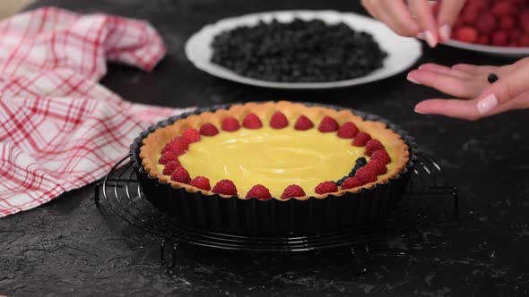 Woman Making Custard Tart with Berries, Tart with Berries