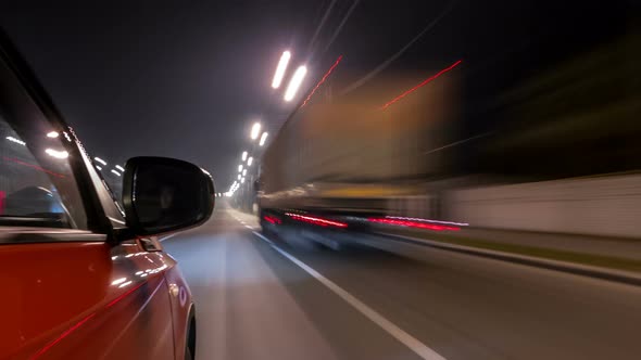 Drivelapse Urban Look From Fast Driving Car at a Night Avenue in a City Timelapse Hyperlapse
