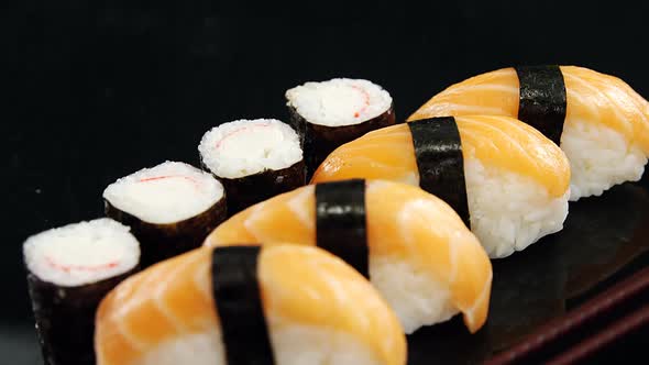 Maki sushi rool and nigiri sushi wrapped in nori seaweed