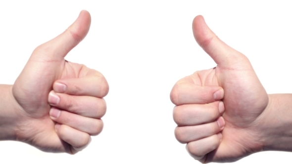 Two Thumbs Up Isolated On a White Background.