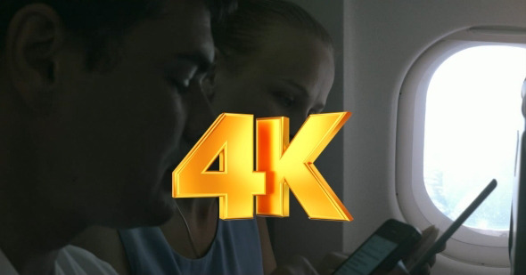 People With Gadgets On a Plane