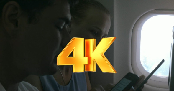 People With Gadgets On a Plane alt