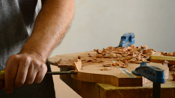 Luthier Working with a Chisel