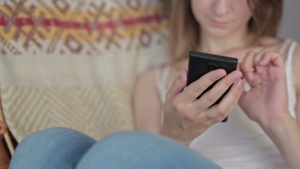 Young Beautiful Woman Sitting With Smart Phone.