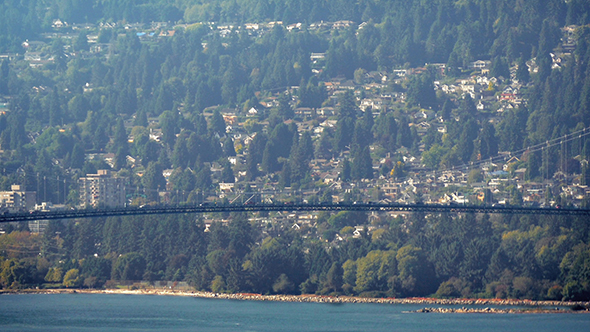 Cars On Bridge Over Water On Warm Day alt