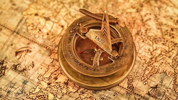 Vintage Compass Lies On An Ancient World Map