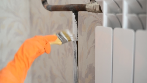 Paints a Heating Radiator In  Apartment