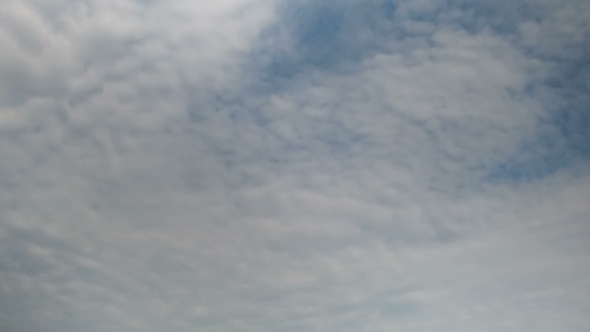 Clouds Moving In The Blue Sky.