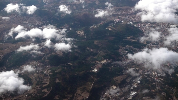 The Airplane Is Flying Above The Clouds