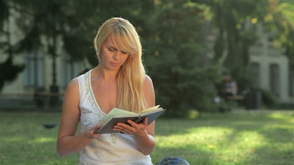 Daughter Covers Eyes Mom Reading a Book