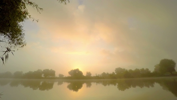 Sunrise  in  Fog on River Water.