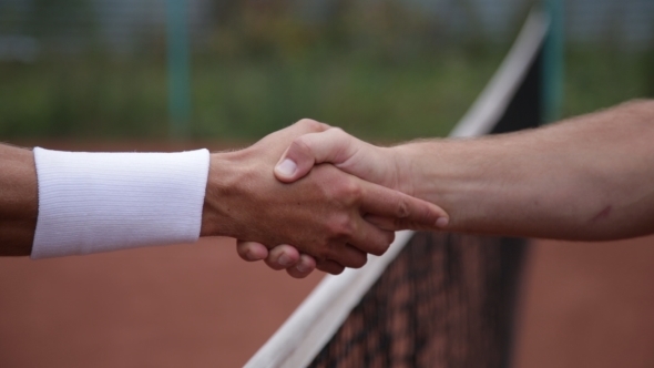 Friendly Hug After Tennis Match