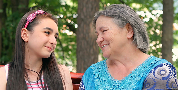 Granddaughter and Grandmother Talking and Laughing