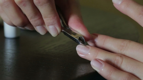 Removal The Cuticle With Nail Clippers