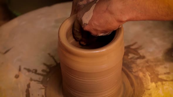 Potter at Work Makes Ceramic Dishes