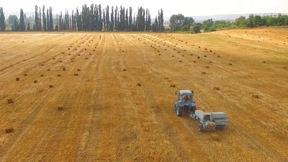 Rural Tractor Baler Standing In Stubble Yellow