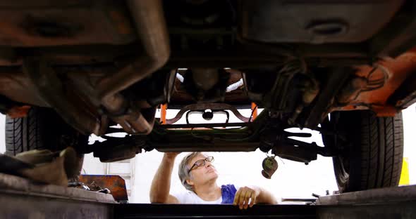 Male Mechanic Servicing a Car 4k