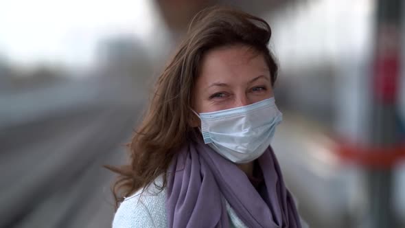 Happy Woman with Mask on Face on Train Platform at Autumn Day, Portrait of Smiling Lady