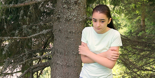 Sad Girl Lost in Forest