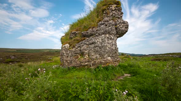 Panorama motion time lapse of rural landscape with grass field during a summer cloudy day in Ireland alt