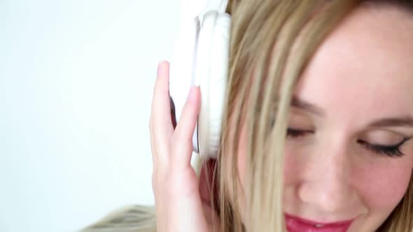 Close Up Of Beautiful Young Blond Woman Dancing With White Headphones 12 alt