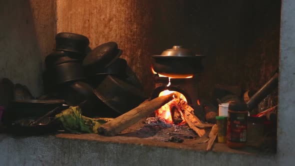 View Burning Fire Heating A Pot For Cooking In Local Kitchen In Sri Lanka 1
