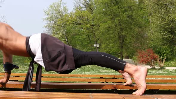 Close Up Of Muscular Man Doing Push Ups On Bench 3