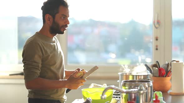 Young Indian Man Preparing Lunch In The Kitchen 1