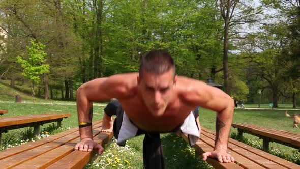 Close Up Of Sports Man Doing Push Ups On Bench 1