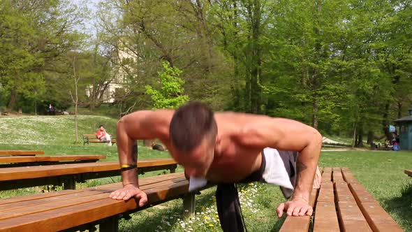 Close Up Of Sports Man Doing Push Ups On Bench 2